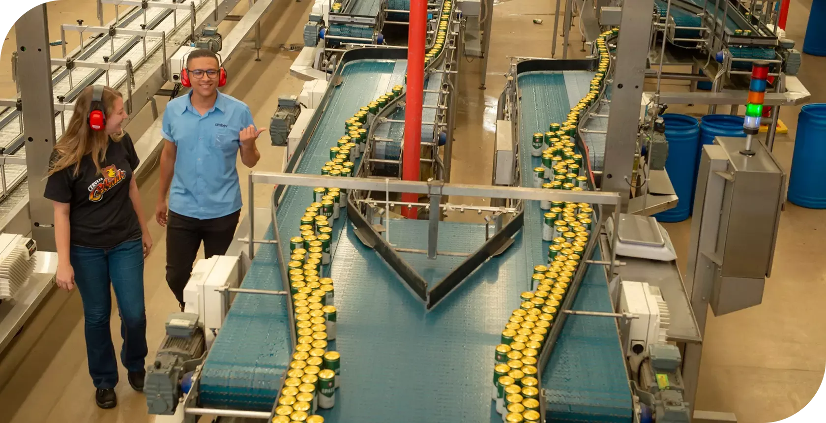 A customer service area features a desk with two employees, one wearing a red uniform and the other assisting a customer. The setting includes a colorful backdrop with life-sized cutouts of young people and the word 'Loop' in large letters. The counter displays digital numbers, and promotional materials are placed on the desk.