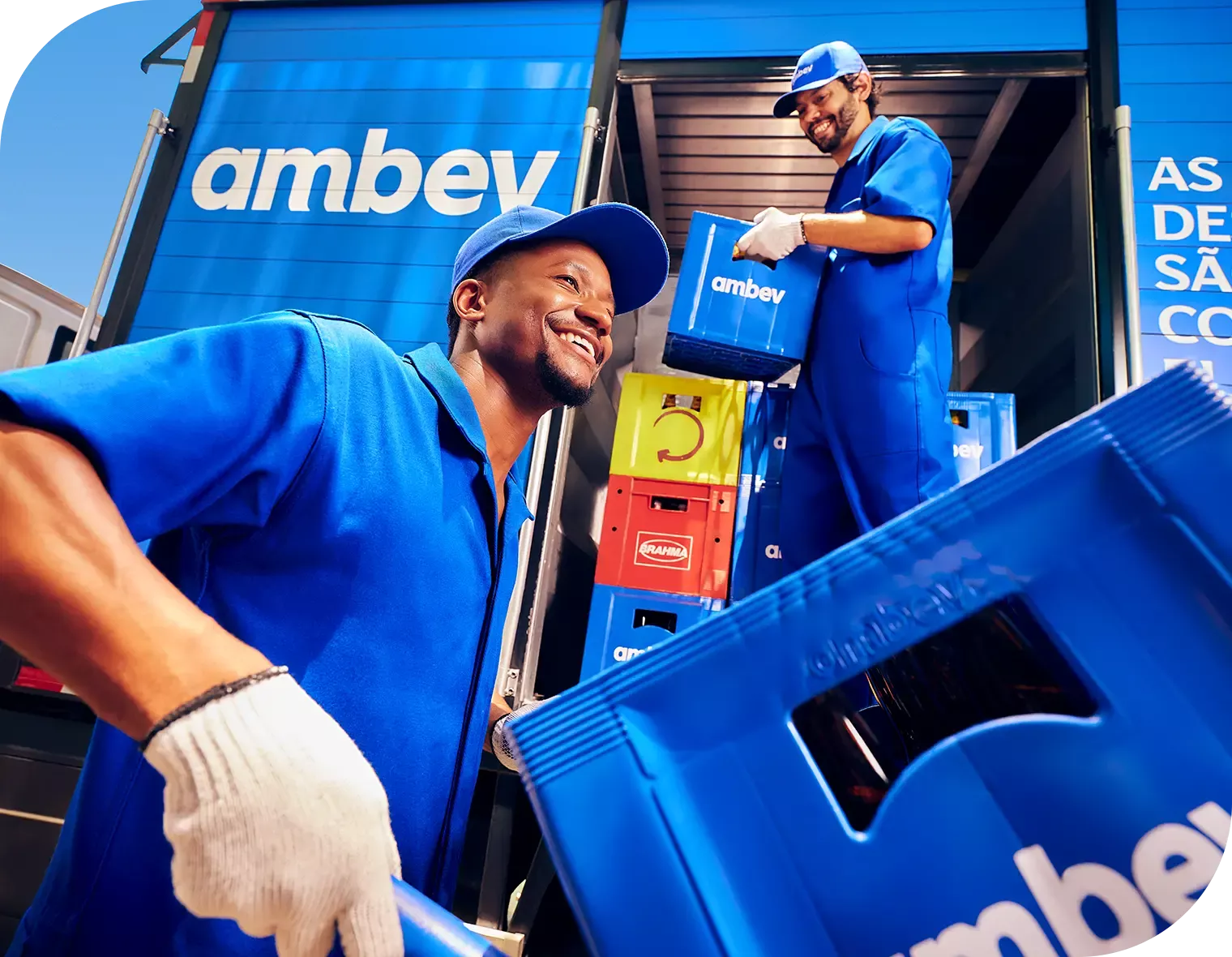Two service windows with blue signs above each window. The left sign reads 'Facturacion Caja' and the right one reads 'Faturamento Caixa.' These windows appear to be part of a billing or payment service area. A few items, such as boxes and papers, are placed behind the windows. A small digital display shows a number.